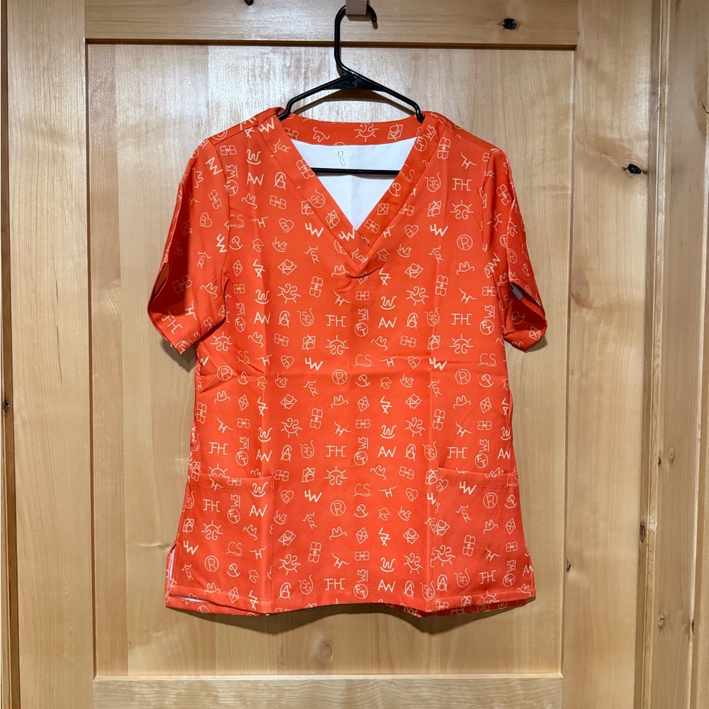 Orange V-Neck Scrub Top with White Symbols